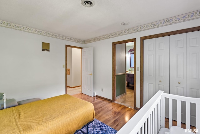 17 Wildwood Trl, Bettendorf, IA 52722 - bedroom with light wood-type flooring and a closet