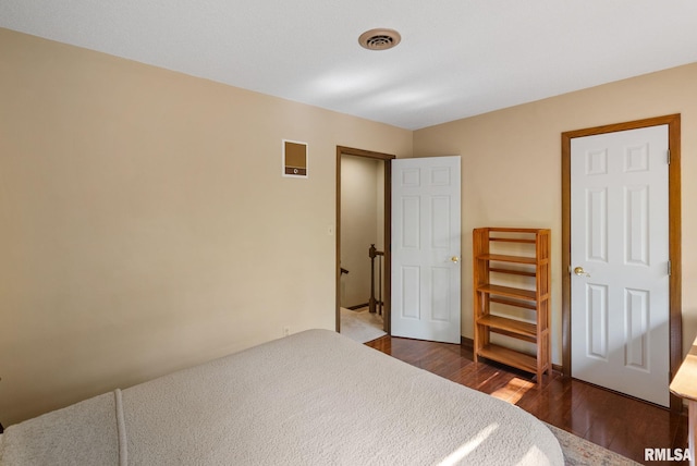 17 Wildwood Trl, Bettendorf, IA 52722 - bedroom with dark wood-style floors