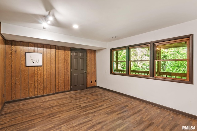 17 Wildwood Trl, Bettendorf, IA 52722 - empty room with baseboards and dark wood-type flooring