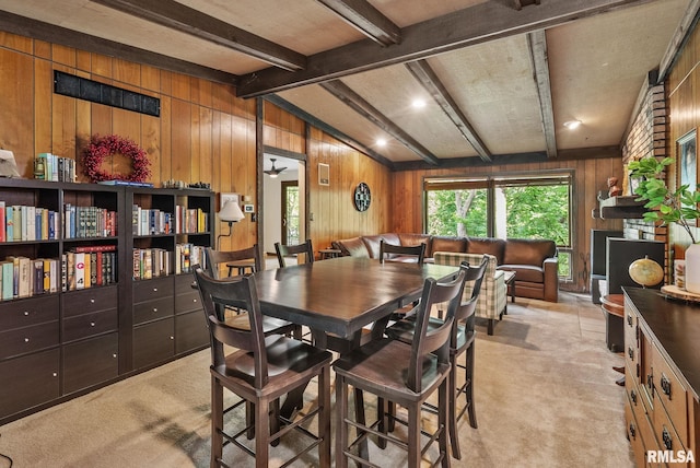 17 Wildwood Trl, Bettendorf, IA 52722 - dining space with wooden walls and light carpet