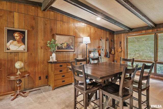 17 Wildwood Trl, Bettendorf, IA 52722 - dining space featuring light colored carpet and wooden walls