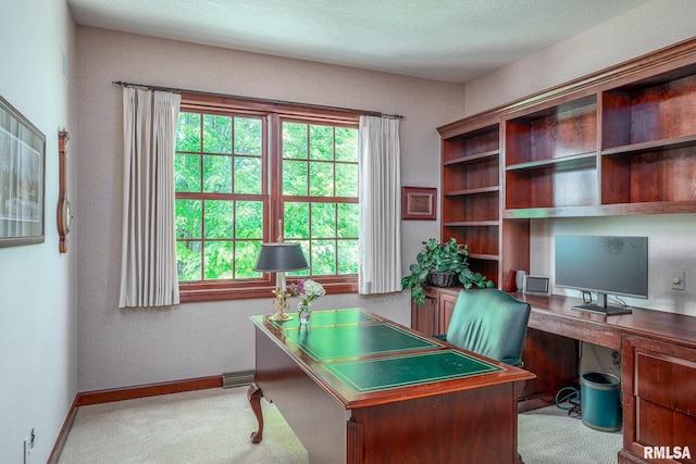 2806 E 42nd Ct, Davenport, IA 52807 - carpeted home office featuring baseboards and built in study area