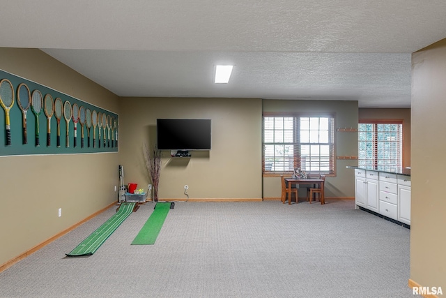 2806 E 42nd Ct, Davenport, IA 52807 - rec room featuring carpet floors and baseboards