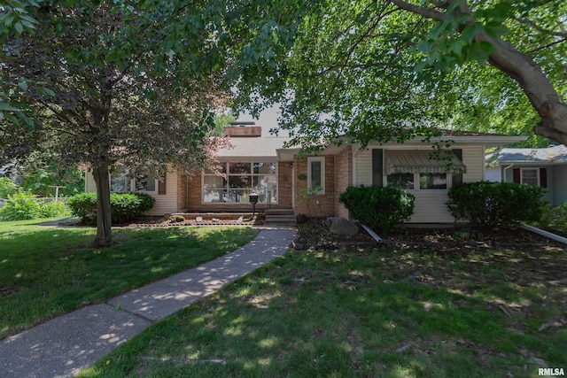 1635 Eastmere Dr, Davenport, IA 52803 - view of front of home with a front yard and brick siding