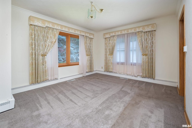 1635 Eastmere Dr, Davenport, IA 52803 - carpeted spare room featuring healthy amount of natural light, crown molding, and a baseboard radiator