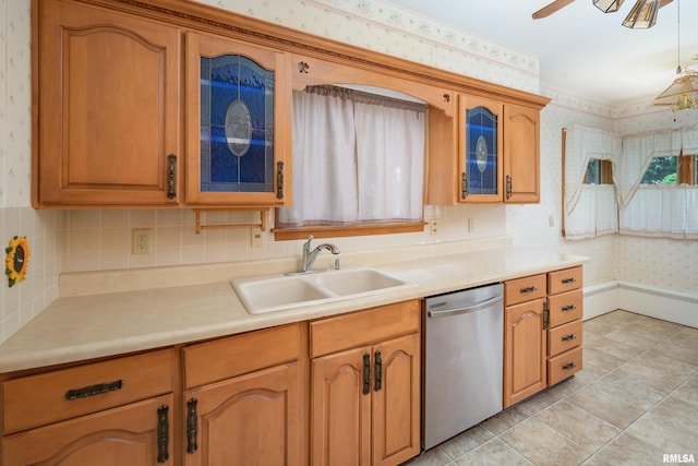 1635 Eastmere Dr, Davenport, IA 52803 - kitchen with wallpapered walls, dishwasher, glass insert cabinets, light countertops, and a ceiling fan