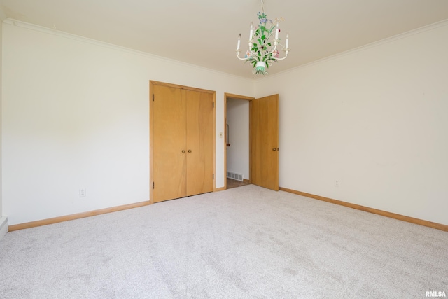 1635 Eastmere Dr, Davenport, IA 52803 - carpeted empty room with ornamental molding and a chandelier