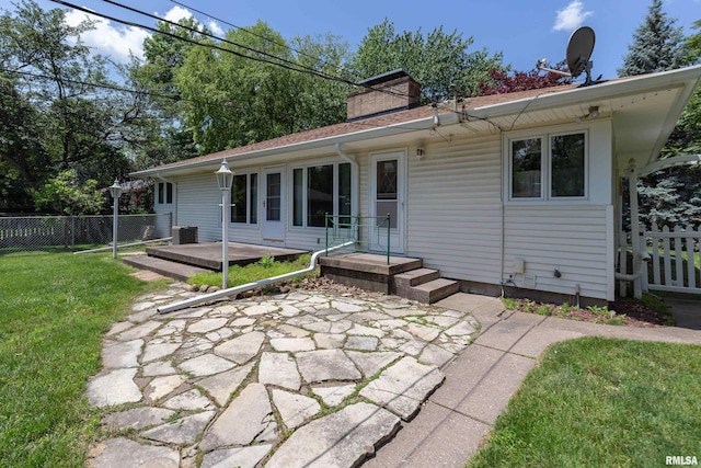 1635 Eastmere Dr, Davenport, IA 52803 - back of property with a patio and a chimney