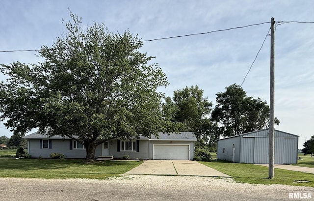 503 Lafayette St, Lafayette, IL 61449 - view of front facade featuring concrete driveway, an attached garage, and a front lawn