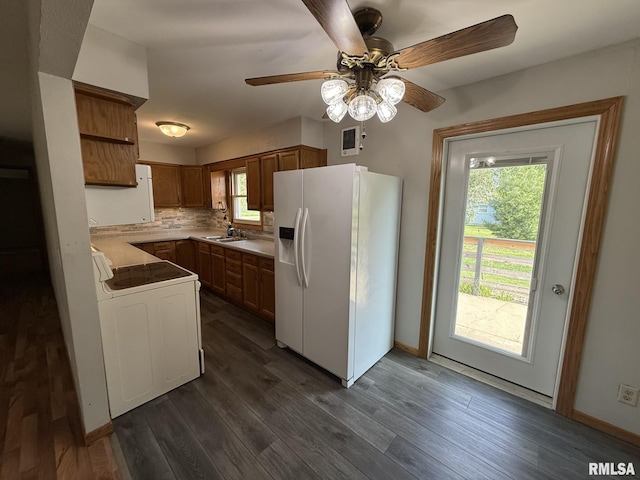 503 Lafayette St, Lafayette, IL 61449 - kitchen featuring white fridge with ice dispenser, stove, dark wood-style floors, ceiling fan, and decorative backsplash