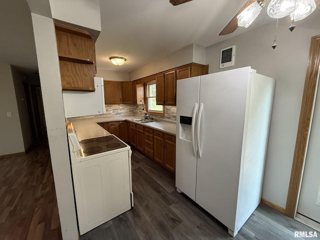 503 Lafayette St, Lafayette, IL 61449 - kitchen with white appliances, a ceiling fan, brown cabinets, and dark wood-type flooring