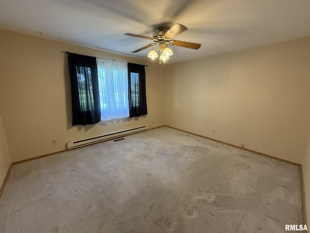 503 Lafayette St, Lafayette, IL 61449 - empty room with baseboard heating, ceiling fan, and light colored carpet