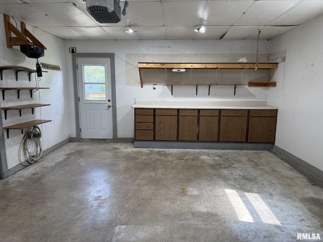 503 Lafayette St, Lafayette, IL 61449 - garage featuring a garage door opener and baseboards