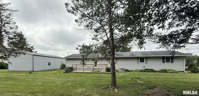 503 Lafayette St, Lafayette, IL 61449 - rear view of property featuring a yard, an outdoor structure, and an outbuilding