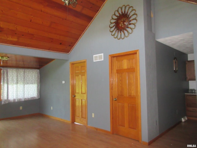 32 Crescent Lk, Alpha, IL 61413 - unfurnished living room featuring high vaulted ceiling, wood finished floors, and wooden ceiling