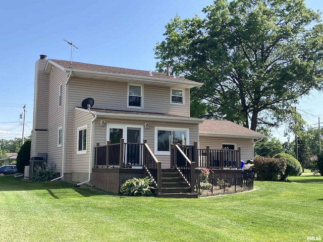 420 E Garfield St, Kewanee, IL 61443 - back of property with a chimney, a wooden deck, and a lawn