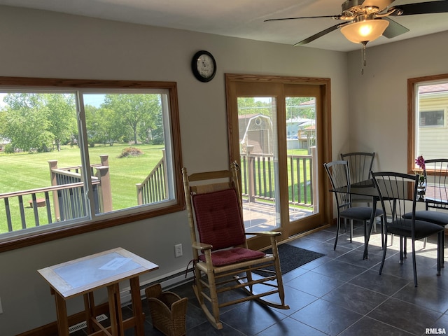 420 E Garfield St, Kewanee, IL 61443 - dining room featuring dark tile patterned flooring and a ceiling fan