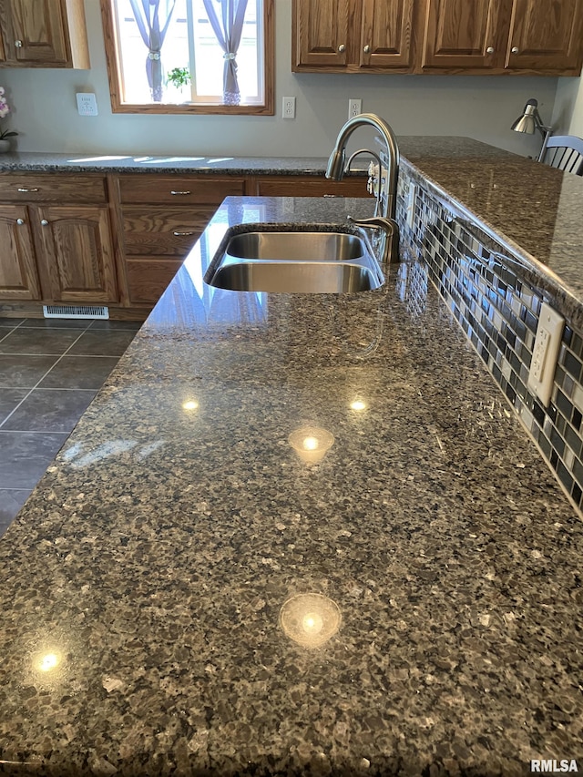 420 E Garfield St, Kewanee, IL 61443 - kitchen featuring a sink and dark stone counters