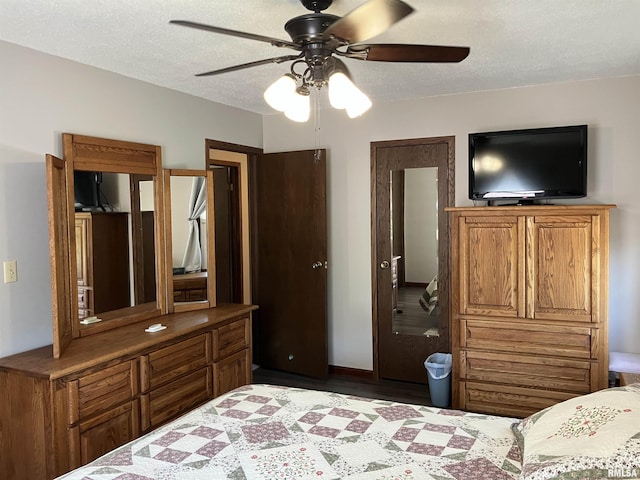 420 E Garfield St, Kewanee, IL 61443 - bedroom with a textured ceiling, wood finished floors, and ceiling fan