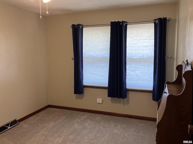 420 E Garfield St, Kewanee, IL 61443 - spare room featuring carpet flooring and baseboards