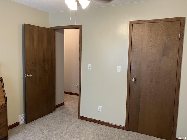 420 E Garfield St, Kewanee, IL 61443 - unfurnished bedroom featuring light carpet and baseboards