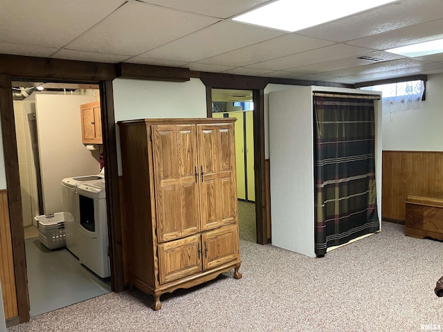 420 E Garfield St, Kewanee, IL 61443 - below grade area featuring a paneled ceiling, wood walls, wainscoting, light carpet, and separate washer and dryer