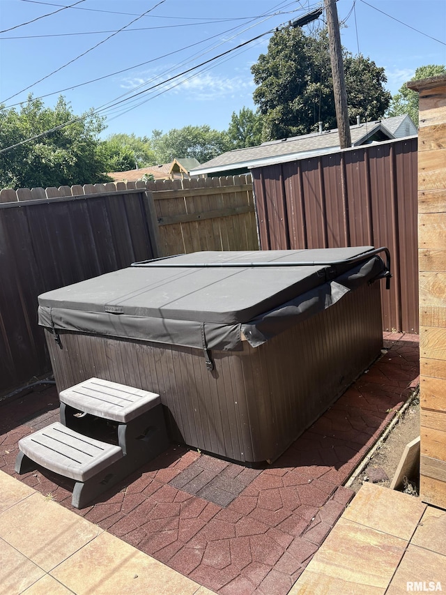 2008 W 70th St, Davenport, IA 52806 - deck with a hot tub and a patio