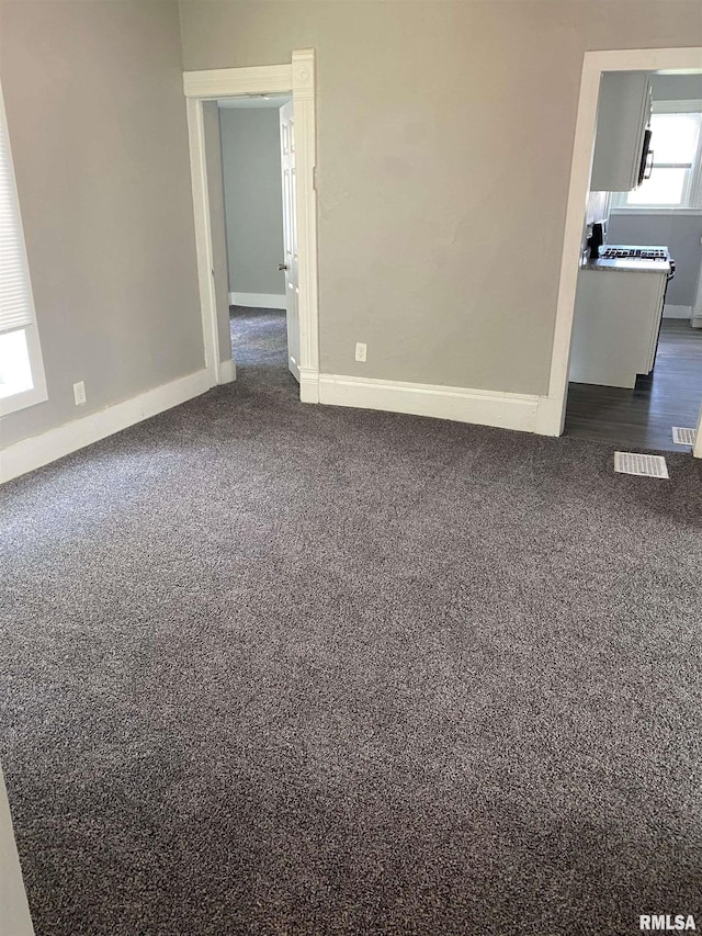 1923 Pershing Ave, Davenport, IA 52803 - empty room featuring dark carpet