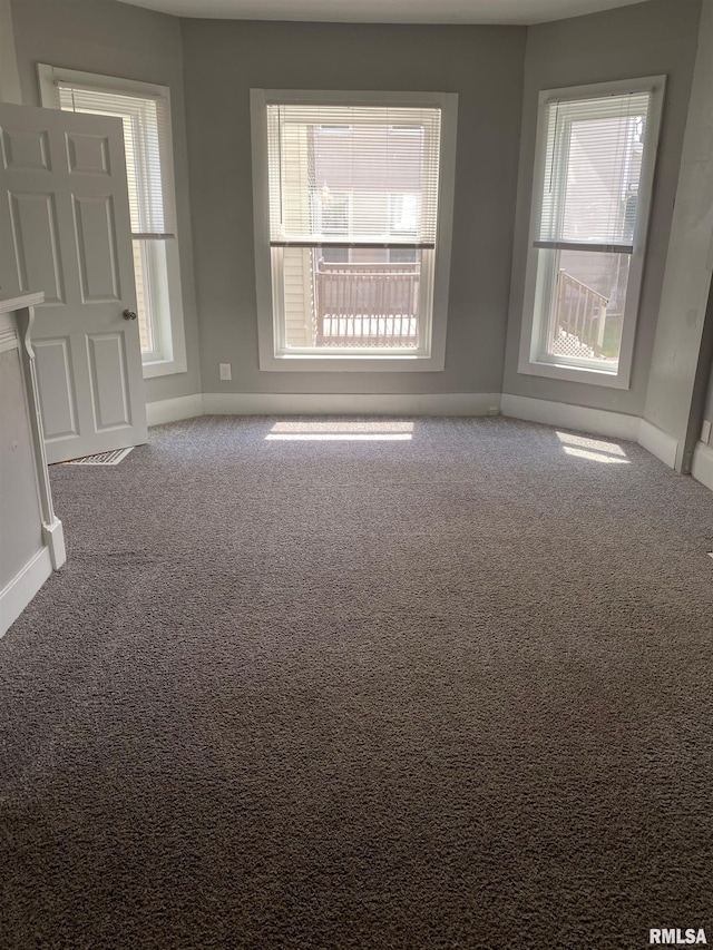 1923 Pershing Ave, Davenport, IA 52803 - empty room featuring plenty of natural light and carpet