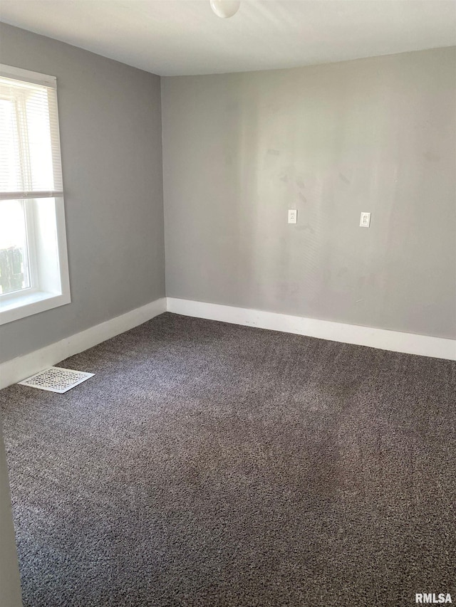 1923 Pershing Ave, Davenport, IA 52803 - carpeted spare room featuring baseboards