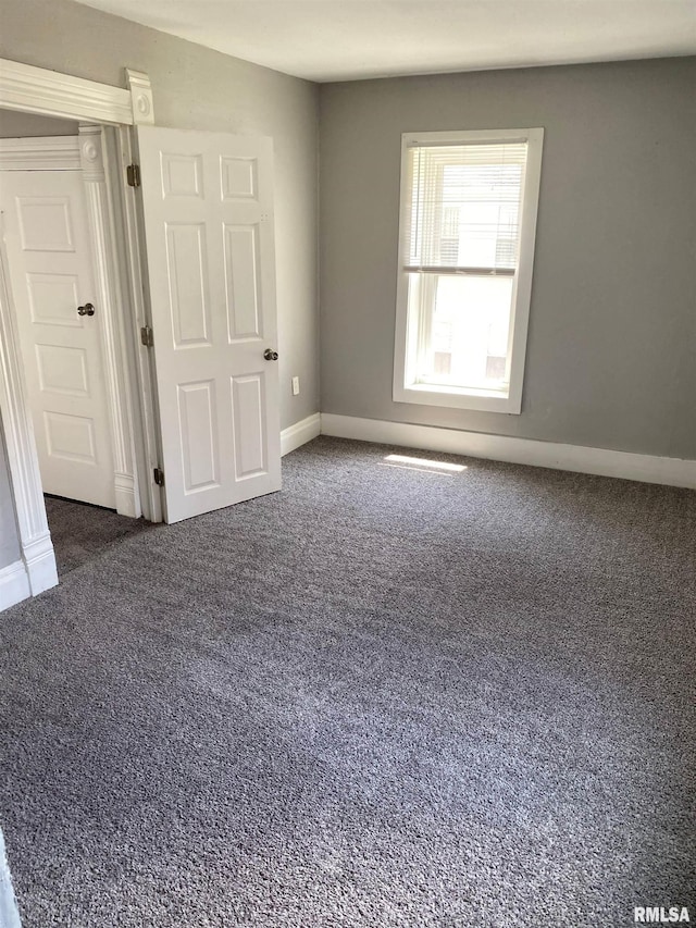 1923 Pershing Ave, Davenport, IA 52803 - carpeted empty room featuring baseboards
