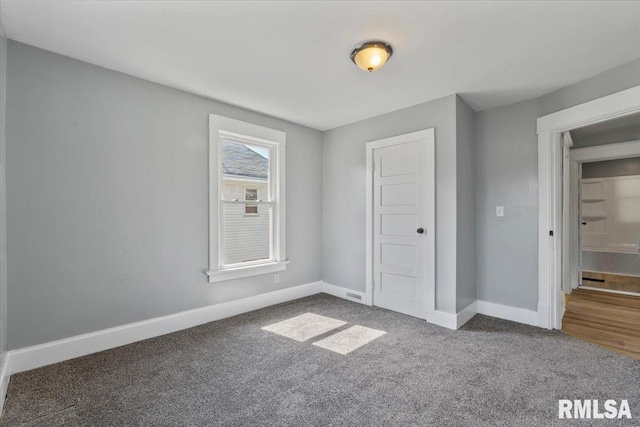 812 W 16th St, Davenport, IA 52804 - unfurnished bedroom with baseboards and carpet floors