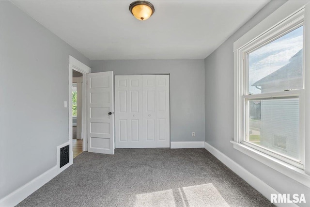 812 W 16th St, Davenport, IA 52804 - unfurnished bedroom with carpet floors and a closet