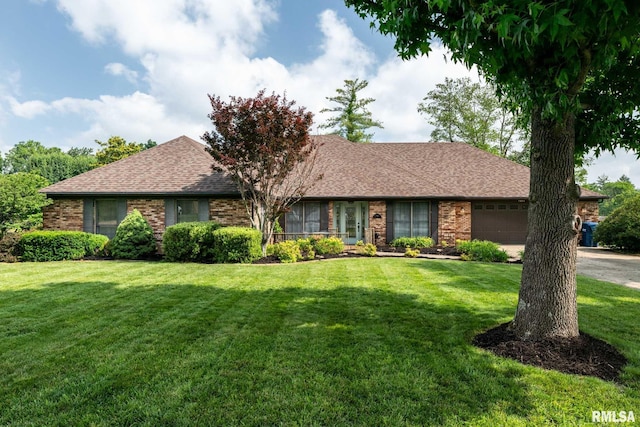 1814 Testa Dr, Marion, IL 62959 - single story home featuring an attached garage, a shingled roof, brick siding, and a front lawn
