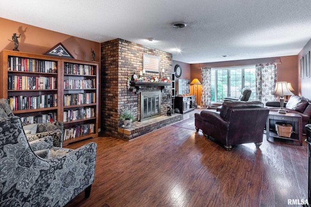 1814 Testa Dr, Marion, IL 62959 - living area with a textured ceiling, a brick fireplace, and wood finished floors