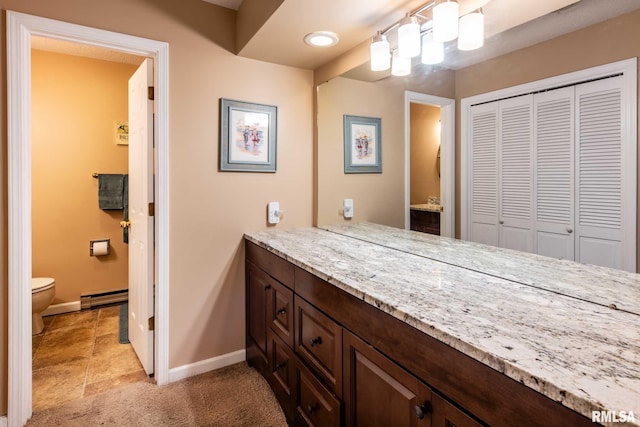 1814 Testa Dr, Marion, IL 62959 - bathroom featuring vanity, a closet, and a baseboard heating unit