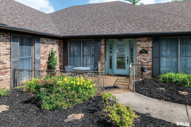 1814 Testa Dr, Marion, IL 62959 - view of exterior entry with a shingled roof and brick siding