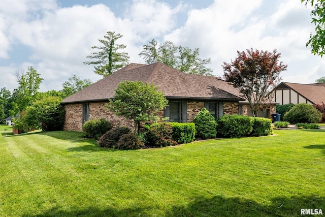 1814 Testa Dr, Marion, IL 62959 - view of side of home featuring a lawn, brick siding, and roof with shingles