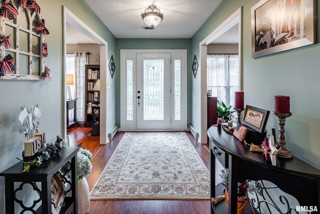 1814 Testa Dr, Marion, IL 62959 - entrance foyer with a baseboard heating unit, wood finished floors, and a textured ceiling