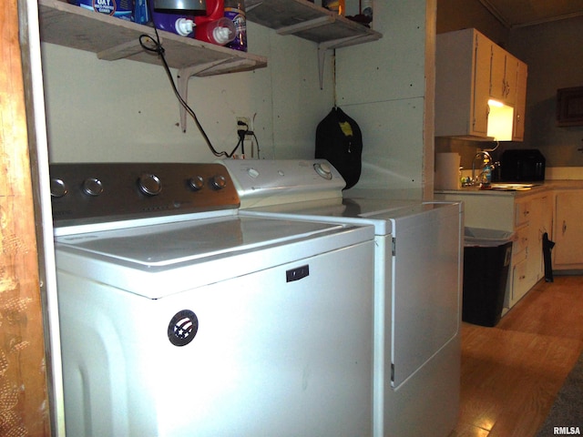 1306 Newton Ave, Johnston City, IL 62959 - laundry area with washing machine and dryer and light wood-style flooring