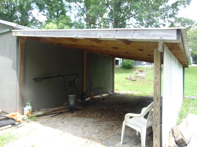 1306 Newton Ave, Johnston City, IL 62959 - view of parking featuring a carport and an outbuilding