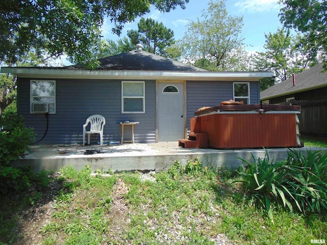 1306 Newton Ave, Johnston City, IL 62959 - rear view of property with a hot tub, a patio, and cooling unit