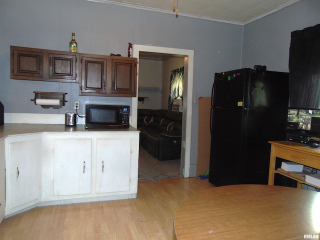 1306 Newton Ave, Johnston City, IL 62959 - kitchen with freestanding refrigerator, light wood-style floors, and ornamental molding