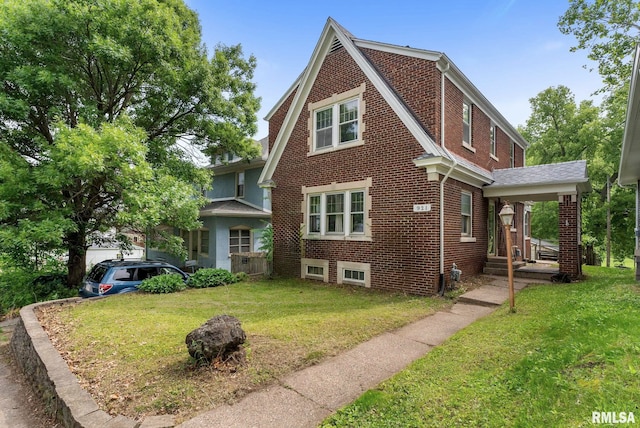 921 45th St, Rock Island, IL 61201 - view of side of home with a lawn and brick siding