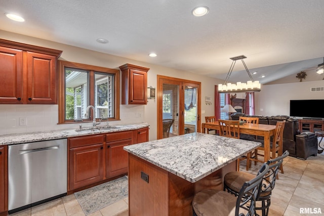 10984 150th St, Davenport, IA 52804 - kitchen featuring dishwasher, plenty of natural light, open floor plan, light stone countertops, and recessed lighting