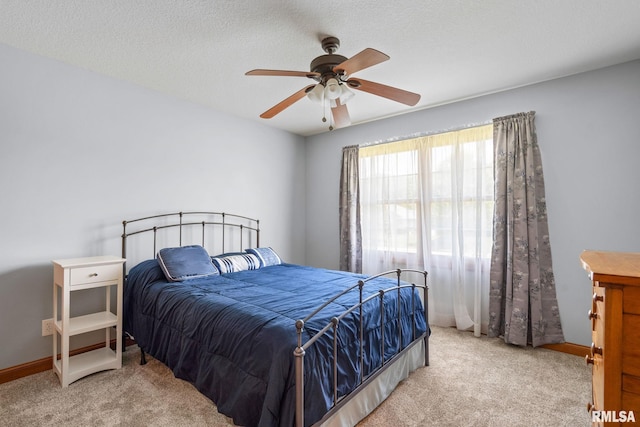 10984 150th St, Davenport, IA 52804 - carpeted bedroom featuring baseboards and ceiling fan