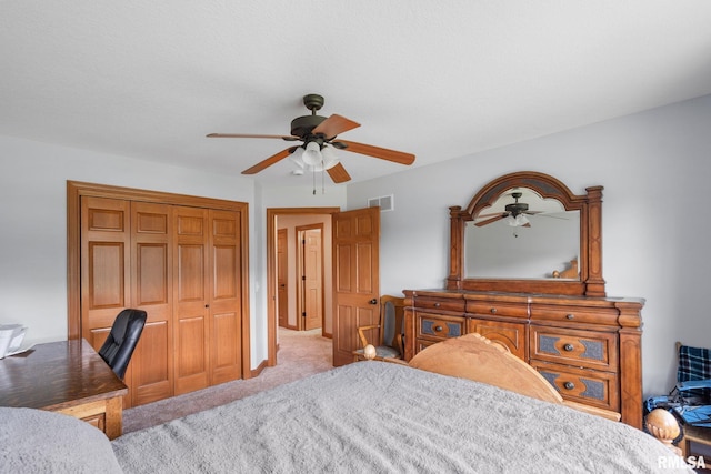 10984 150th St, Davenport, IA 52804 - carpeted bedroom featuring a closet, a desk, and ceiling fan