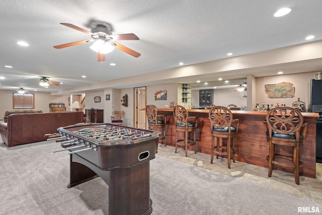 10984 150th St, Davenport, IA 52804 - playroom with bar, ceiling fan, recessed lighting, and a textured ceiling