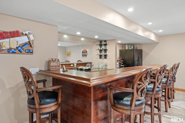 10984 150th St, Davenport, IA 52804 - indoor wet bar with black appliances and recessed lighting