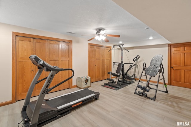 10984 150th St, Davenport, IA 52804 - exercise room featuring a ceiling fan, light wood finished floors, and recessed lighting